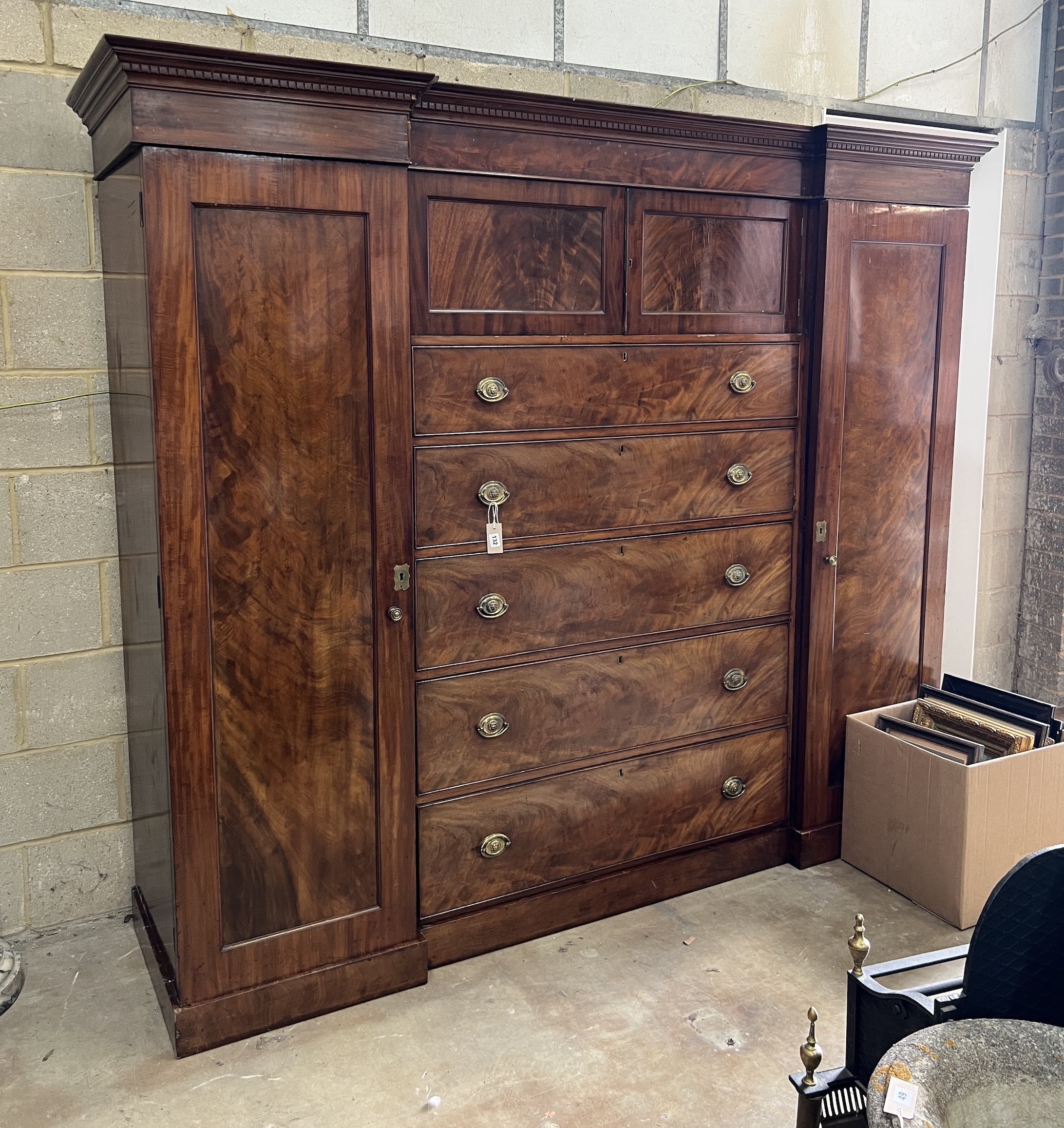 An early Victorian mahogany Beaconsfield wardrobe, width 232cm, depth 61cm, height 196cm This lot splits into 5 sections. Top cornice, base, two sides (identical) and a middle section., Top Cornice, 228cm – Width, 62cm –